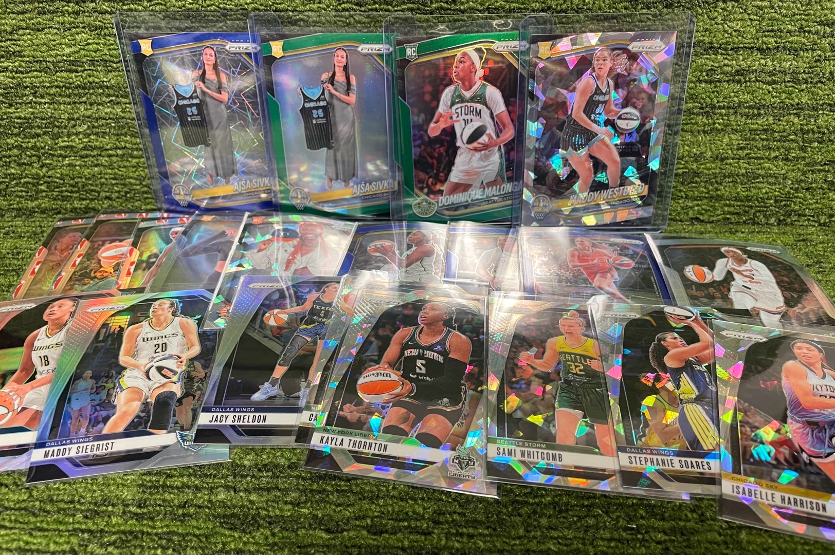 lot 53b image: 2025 PRIZM WNBA Mixed Inserts Lot, Silver Refractors, Cracked Ice, Green Parallels, & Blue Velocities 