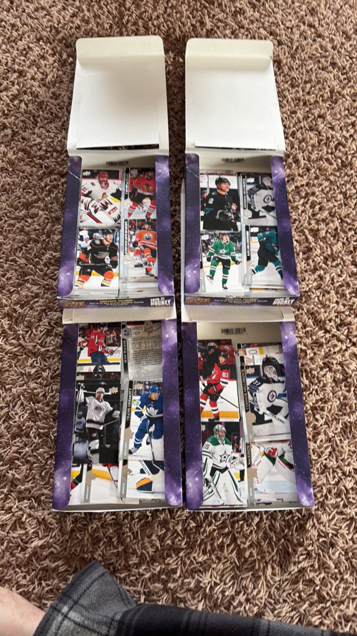 Four Opened Boxes of 2020-21 Upper Deck Hockey Card Boxes, Looks Like the Young Guns Rookies Have Been Taken Out But the Star Cards are Mostly There Along With Commons, Includes A Few Hundred Cards