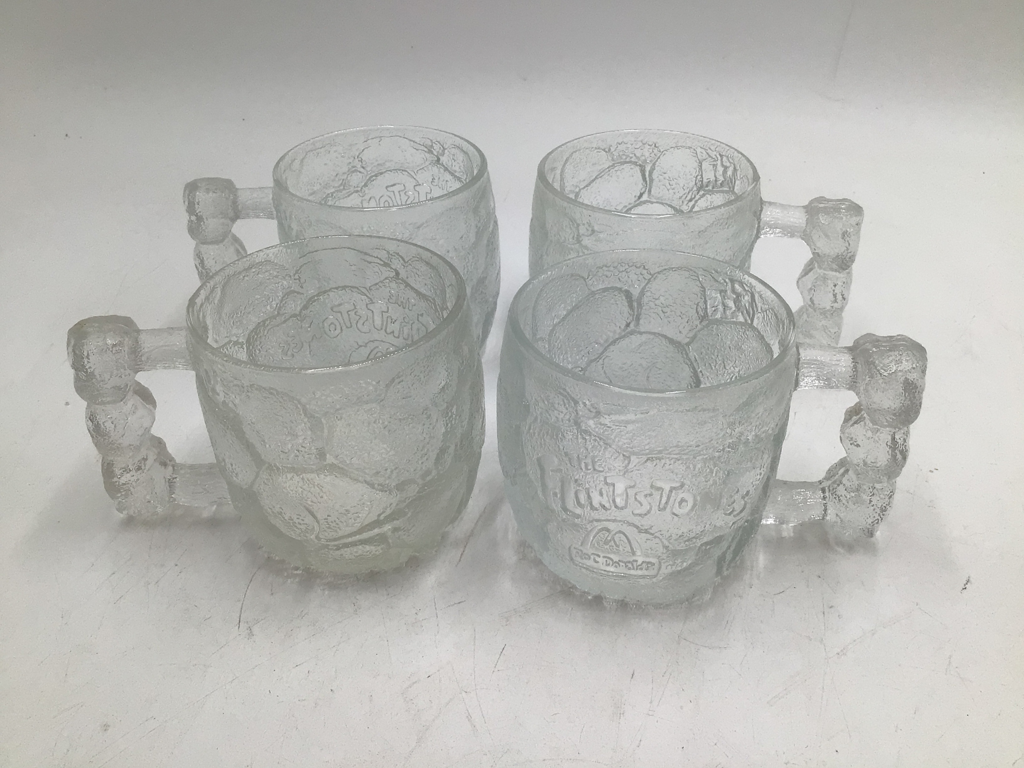 lot 102 image: Vintage Flintstone glass mugs
