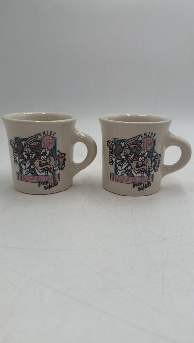 lot 113 image: Vintage Looney Tunes Sip n Slurp Mug Pair  Bugs Bunny & Taz, Free Refills Promo