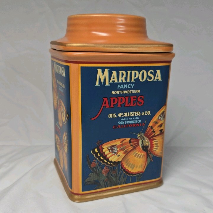 lot 122 image: Vintage Oneida Mariposa Apples Tin Canister  Butterfly Label Reproduction