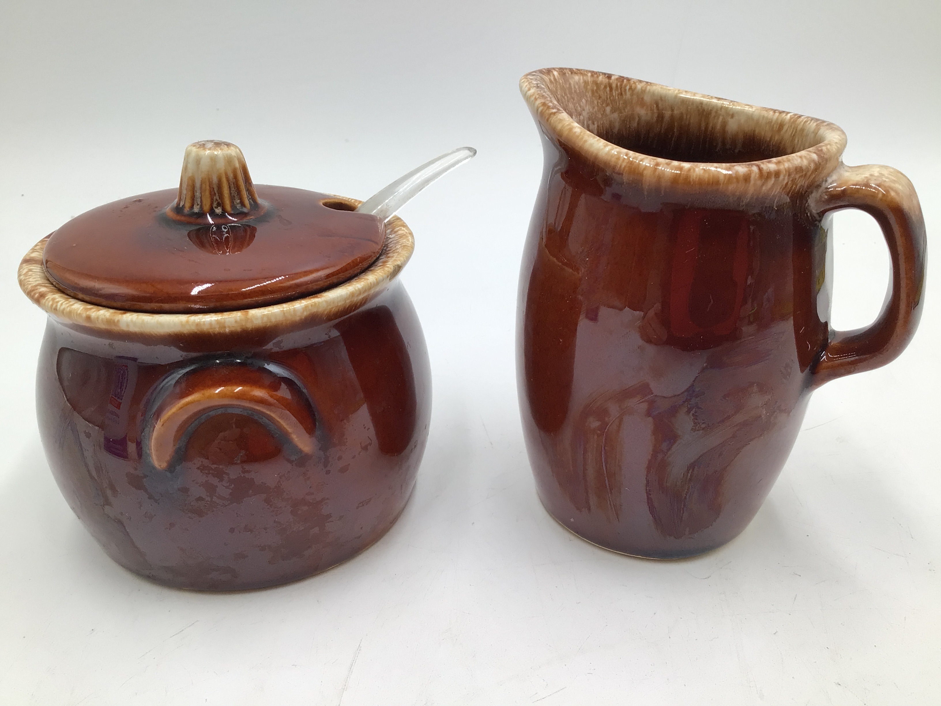 lot 157 image: Vintage Hull Oven Proof Brown Drip Glaze Creamer and Sugar Set