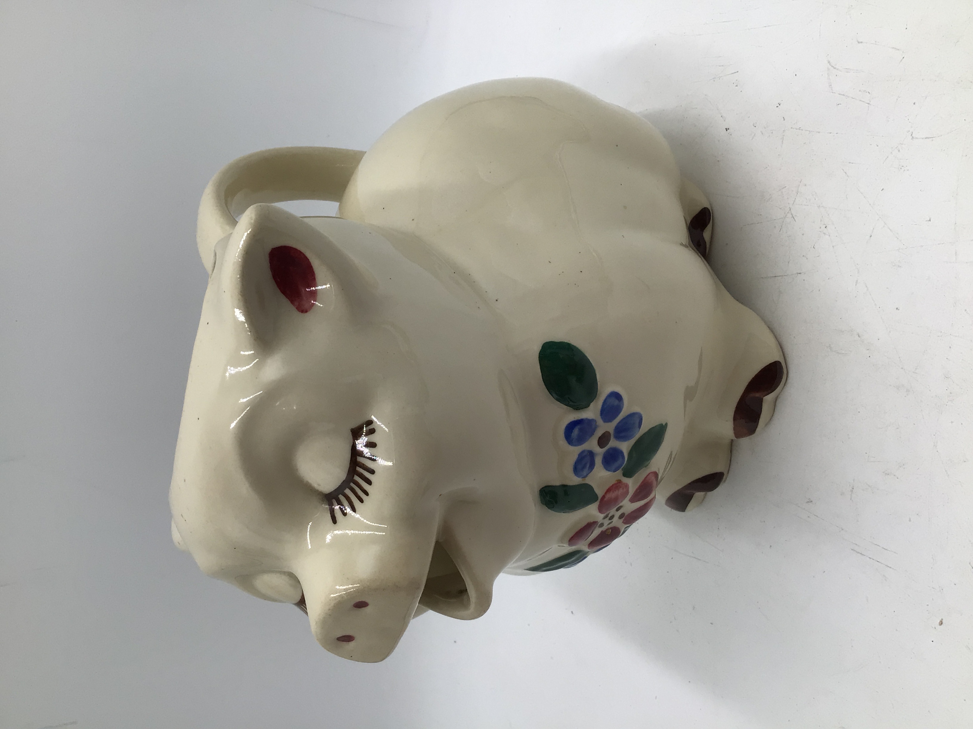 lot 192 image: Vintage Smiley Pig Creamer Pitcher Patented USA Floral Design