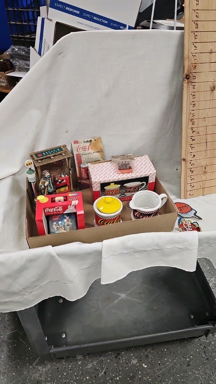 lot 103 image: Coca Cola Figures, Bank, Cars, etc