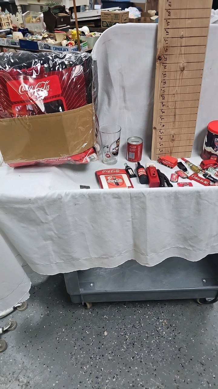 lot 134 image: Coke Trinkets, Stapler, bottle opener, flashlight, etc