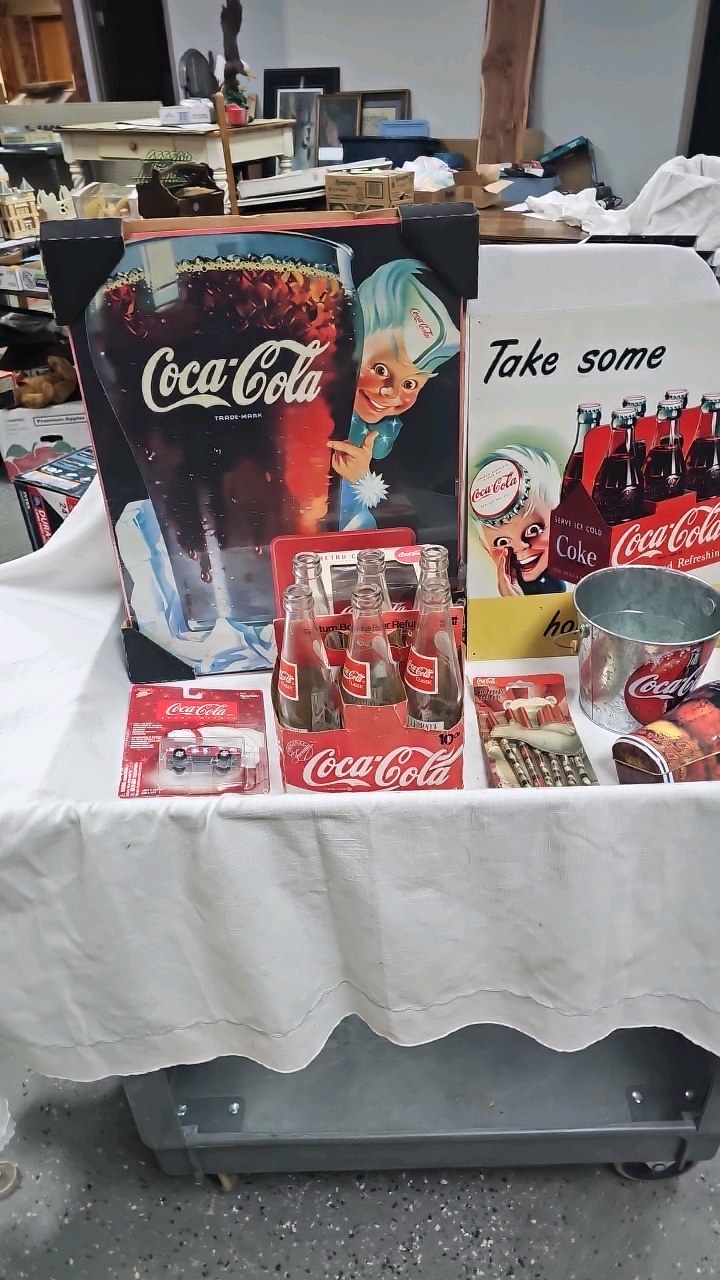 lot 138 image: Coke Picture, Bottles, Bucket, Tins,