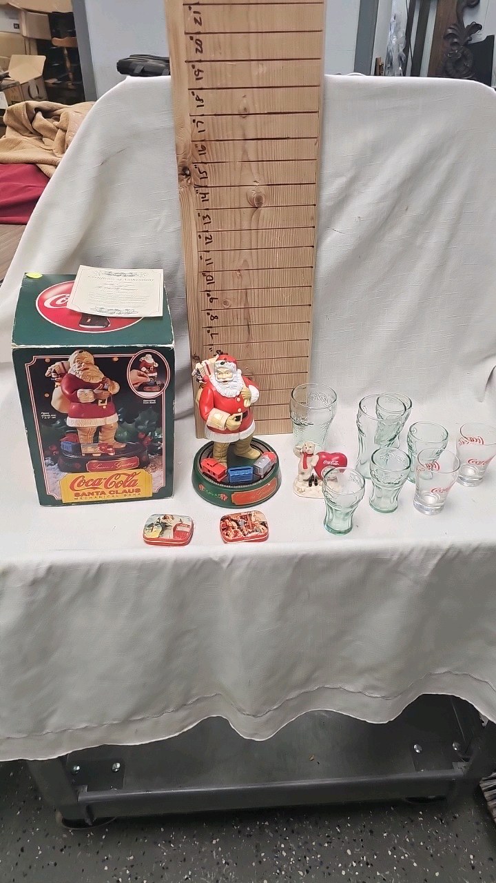 lot 18 image: Coca Cola Clock, Shotglasses, Santa Musical Bank wbox