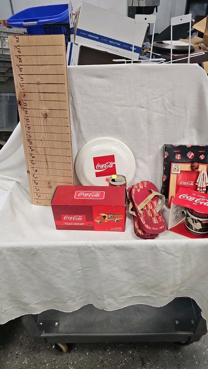 lot 83 image: Coca Cola Mug, 1925 Mack Truck Model, Flip Flops, Picture Frame