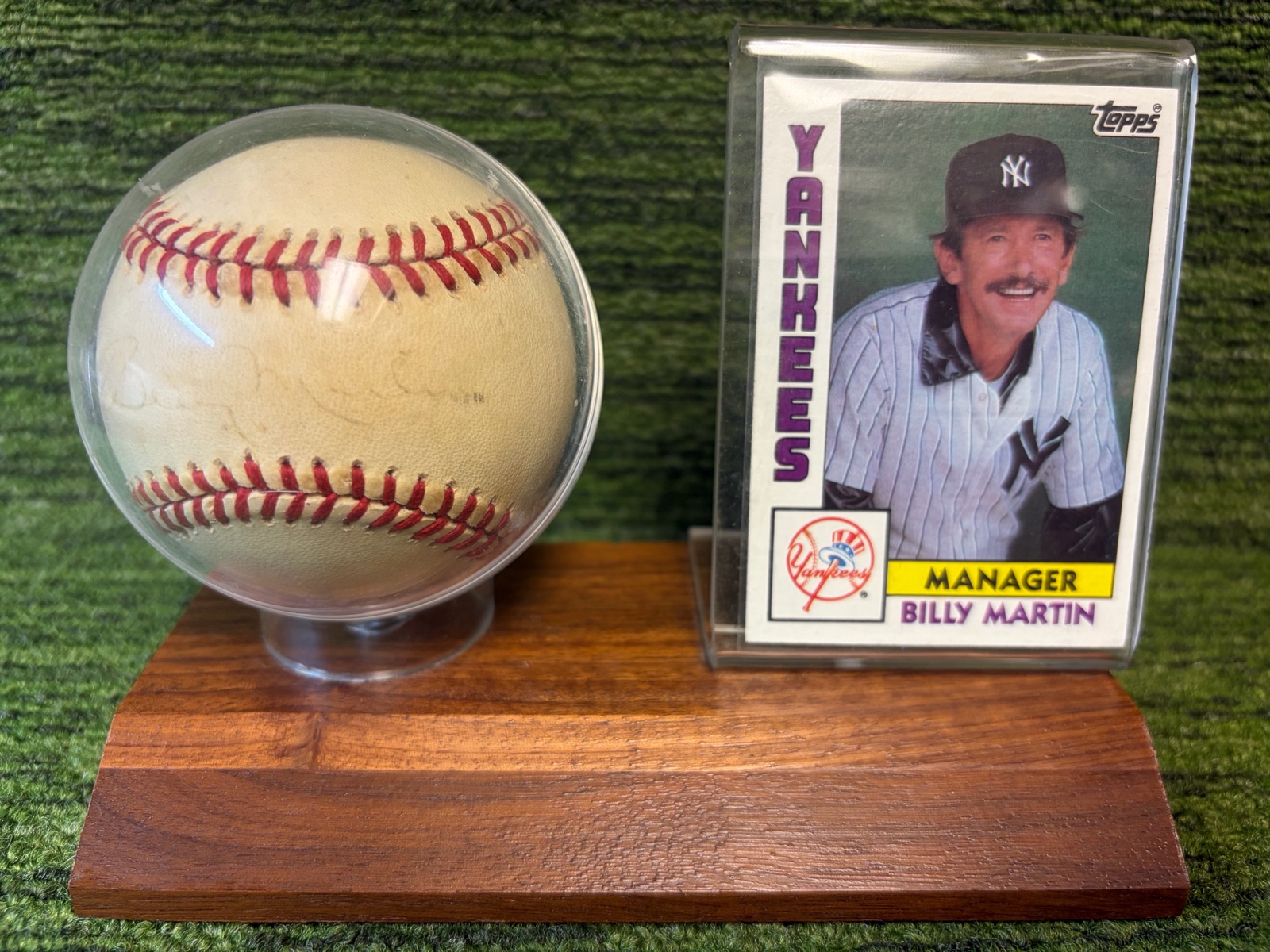 lot 141A image: Billy Martin New York Yankees Manager Autographed Baseball in Stand with Card -Autographed very faded- Neat Piece