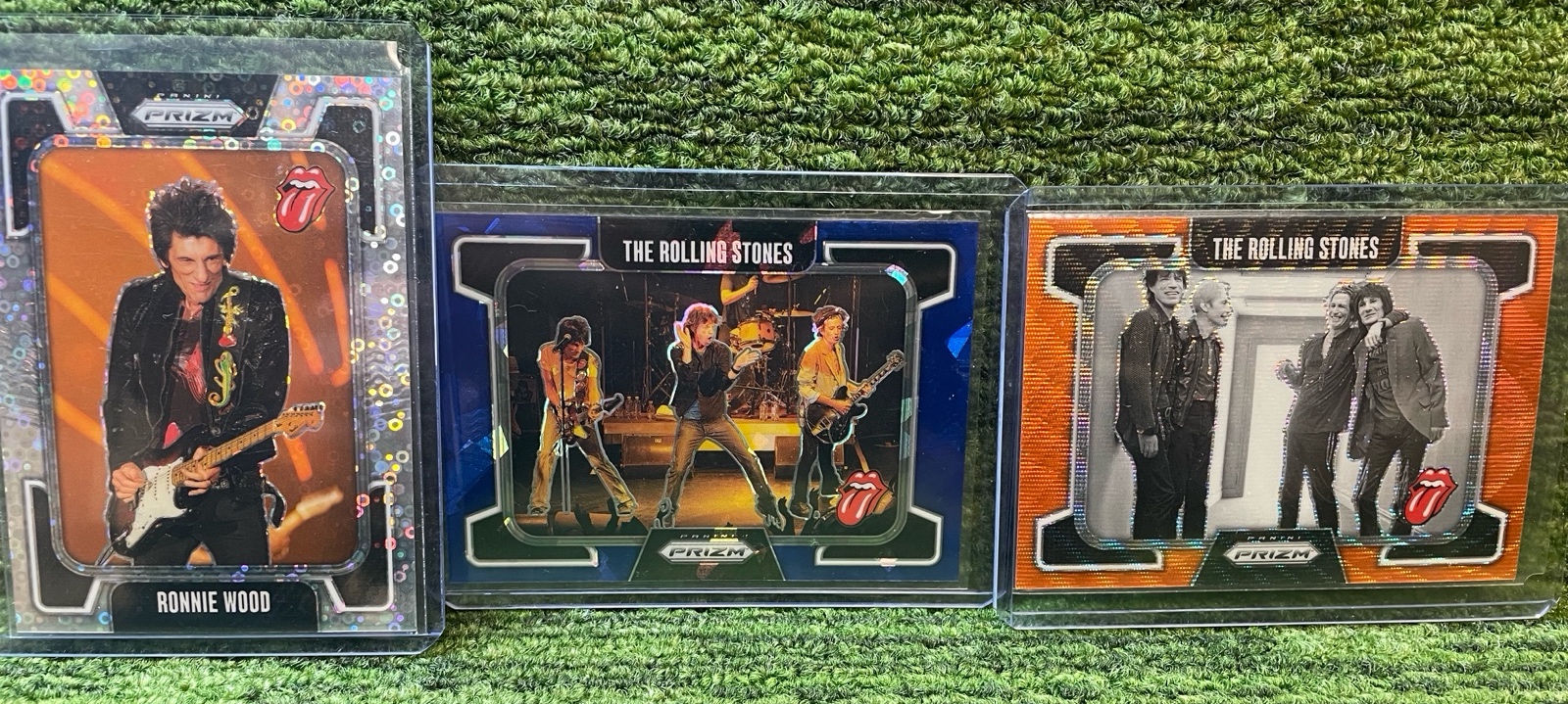 lot 162 image: 2025 PRIZM The The Rolling Stones, Ronnie Wood149, The Rolling Stones Blue75, The Rolling Stones Orange259 (3 Total)