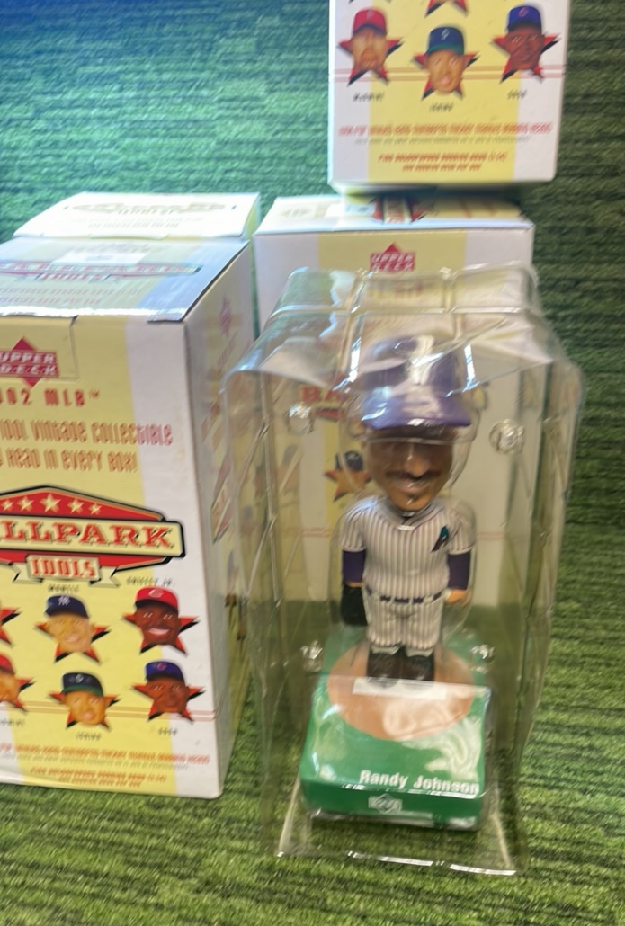 lot 56 image: Lot of 4 Bobble Heads, Randy Johnson, Roberto, Alomar, Jason Giambi, and Luis Gonzales in the Box 2002 Upper Deck, Ballpark Idols (4 total)