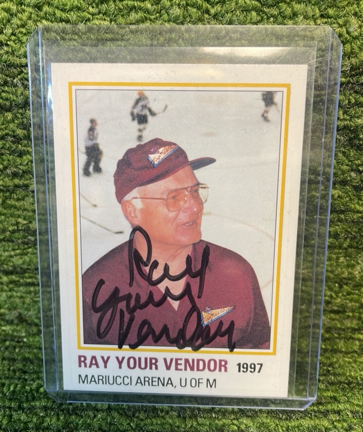 lot 67 image: 1997 Ray Your Vendor Mariucci Arena U of M Card- Serving Since 1962, Autographed 