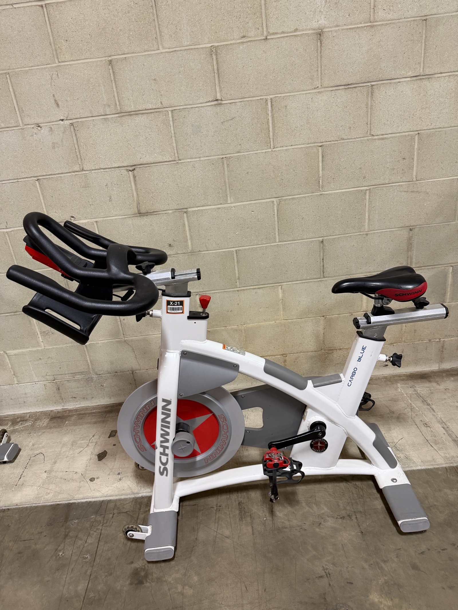 lot 7 image: Schwinn Carbon Blue Commercial Indoor Cycle  Spin Bike