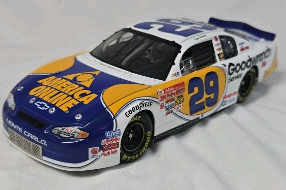 lot 124 image: Dale Earnhardt Sr. America Online Goodwrench Monte Carlo  Blue and Gold Diecast Replica