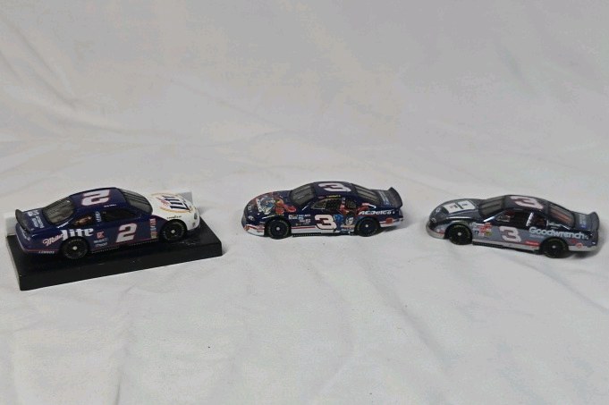 lot 131 image: Assorted Dale Earnhardt Sr. and Rusty Wallace Diecast Cars  Miller Lite and Goodwrench Replicas