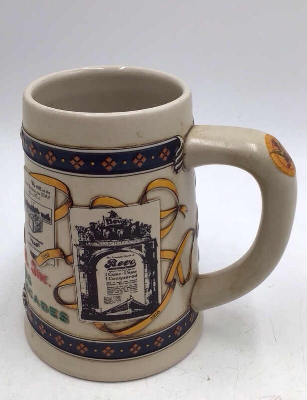 lot 156 image: Vintage Anheuser-Busch Bevo Advertising Stein  Fourth in Decades Series 1918-1932