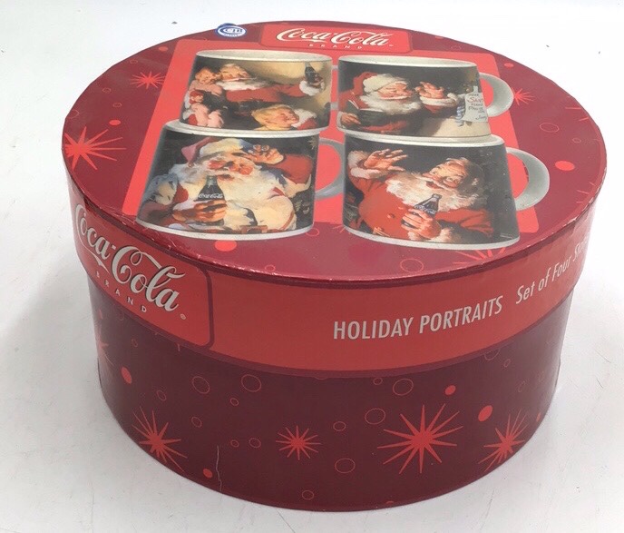 lot 164 image: Vintage Coca-Cola Holiday Portraits Mug Set  Four Santa Mugs in Original Box