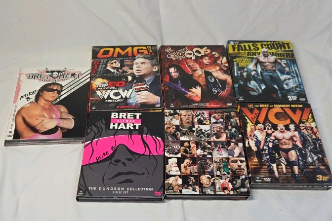lot 278 image: Vintage WWE and WCW Wrestling DVD Set  Bret Hart, OMG Moments, and Nitro Collections