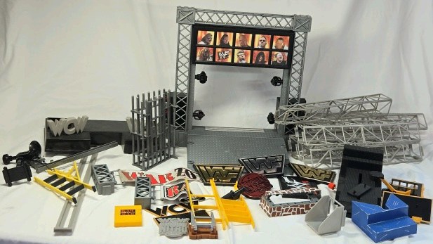 lot 284 image: WCW nWo and WWF Wrestling Ring Accessories Lot  Entrance Stage and Playset Parts