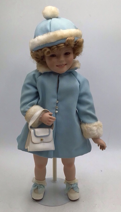 lot 40 image: Vintage Shirley Temple Porcelain Doll  Toddler in Blue Winter Coat