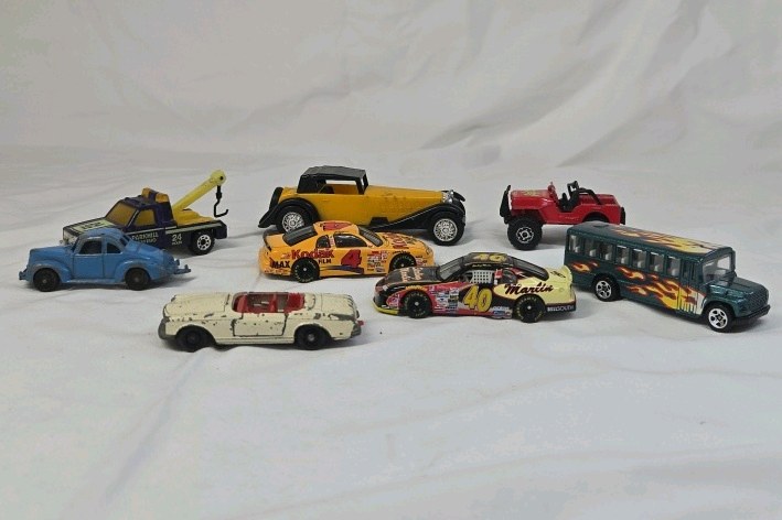 lot 92 image: Assorted Vintage Diecast Toy Vehicles  Mix of Trucks, Race Cars, and Classic Cars