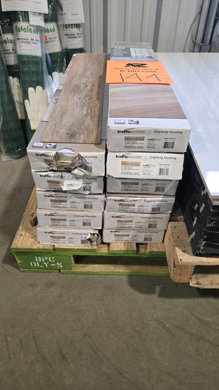 lot 144 image: (11 cases) TrafficMaster Khaki Oak 4 MIL x 6 in. W x 36 in. L Grip Strip Water Resistant Luxury Vinyl Plank Flooring (264 sqft)