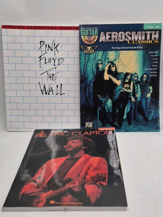 lot 173 image: Guitar Tab Books  Pink Floyd The Wall, Aerosmith Classics, Best of Eric Clapton