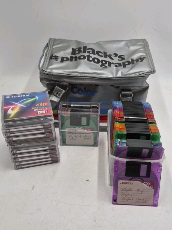 lot 185 image: Vintage Zip Disks, Floppy Disks, and Carrying Case  Fujifilm, Memorex, Iomega
