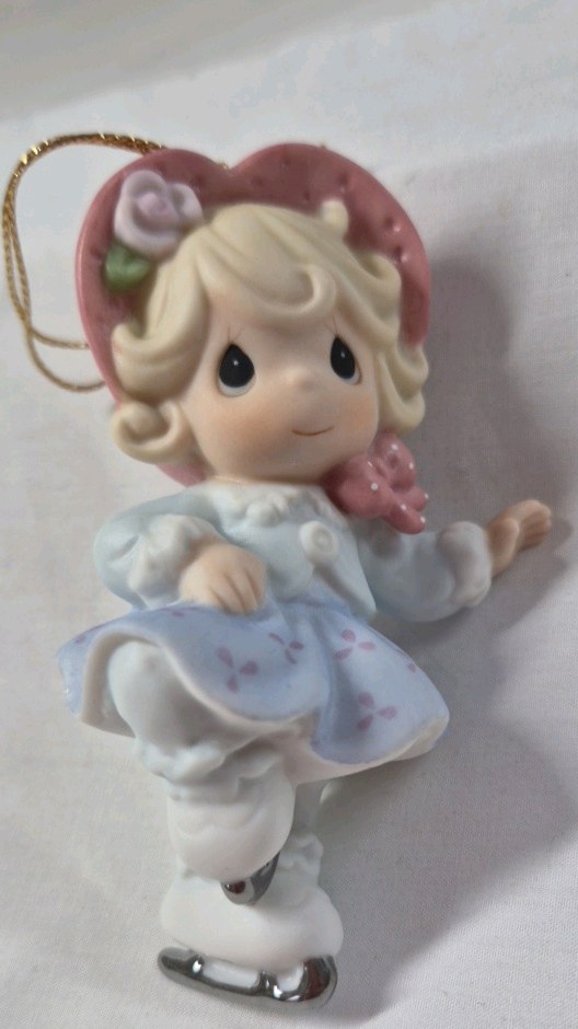 lot 197 image: Precious Moments Ornament  Girl Ice Skating with Heart Hat