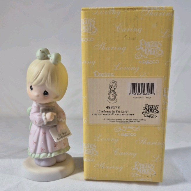 lot 204 image: 1996 Precious Moments Ornament  Girl Angel Confirmed In The Lord with Bible