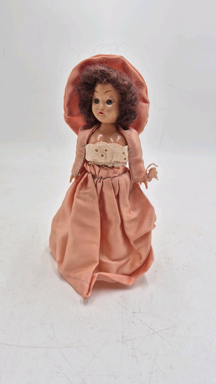 lot 236 image: Vintage Miniature Doll  Peach Satin Dress with Oversized Bonnet