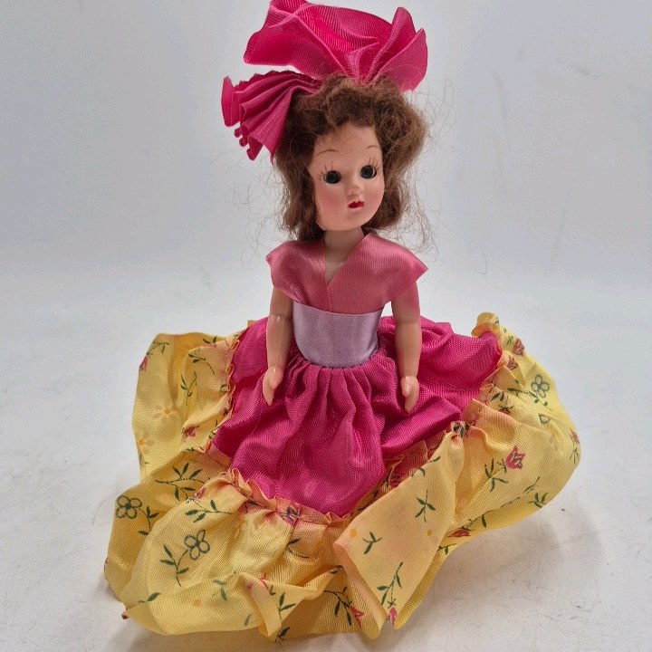 lot 237 image: Vintage Madame Alexander Doll  Pink Floral Dress with Large Bow Headdress