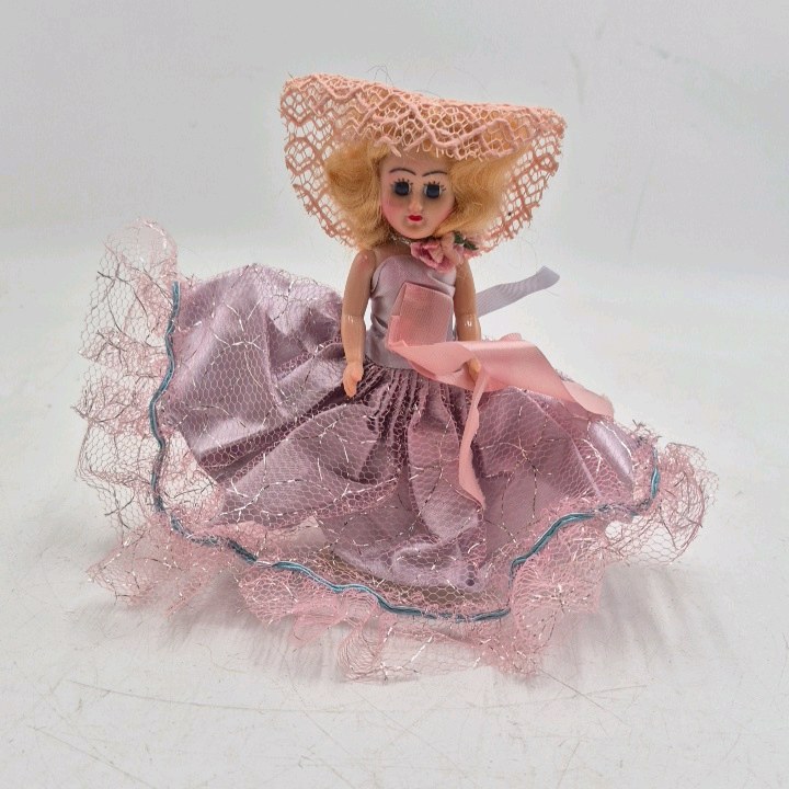 lot 242 image: Vintage Miniature Doll  Pink Satin Dress with Net Overskirt and Large Bow Hat