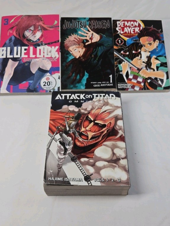 lot 259 image: Manga Lot  Blue Lock Vol 3, Jujutsu Kaisen Vol 1, Demon Slayer Vol 1, Attack on Titan Omnibus 1