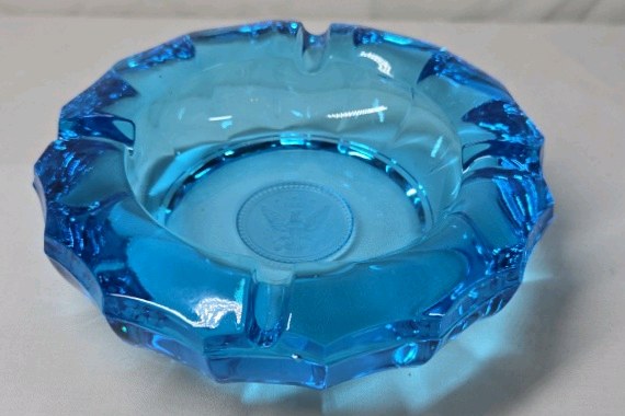 lot 276 image: Vintage Blue Glass Ashtray  Scalloped Rim Embossed Eagle Medallion