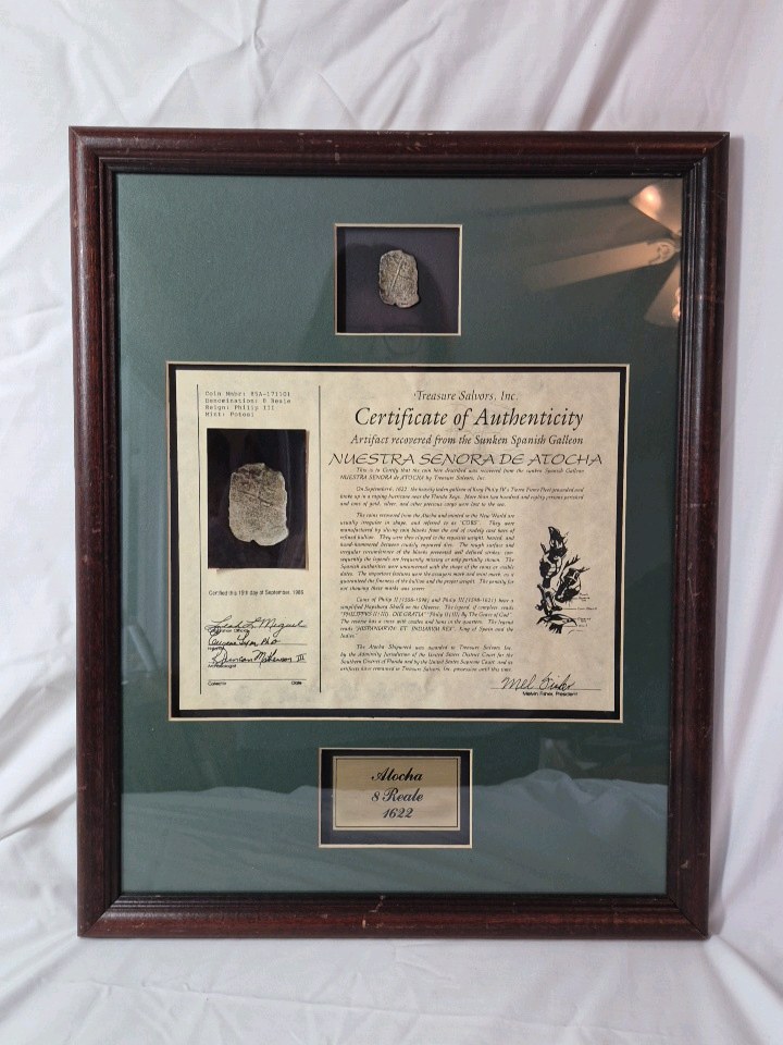 lot 31 image: Framed Atocha Shipwreck 8 Reale Coin  Certificate of Authenticity