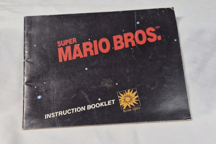 lot 51 image: Vintage Super Mario Bros. Instruction Booklet  Nintendo NES Manual