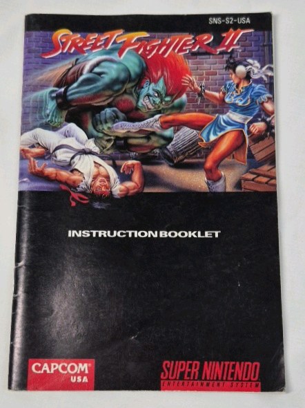 lot 52 image: Vintage Super Nintendo Street Fighter II Instruction Booklet  Capcom