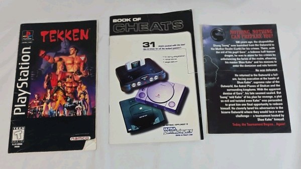 lot 77 image: Vintage PlayStation Tekken Instruction Booklet with Cheats Supplement