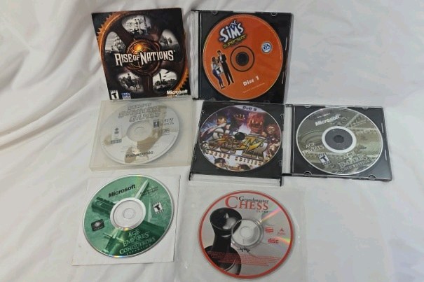 lot 85 image: Vintage PC Strategy Game Disc Lot  Rise of Nations, The Sims Chess, Age of Empires, Grandmaster Chess