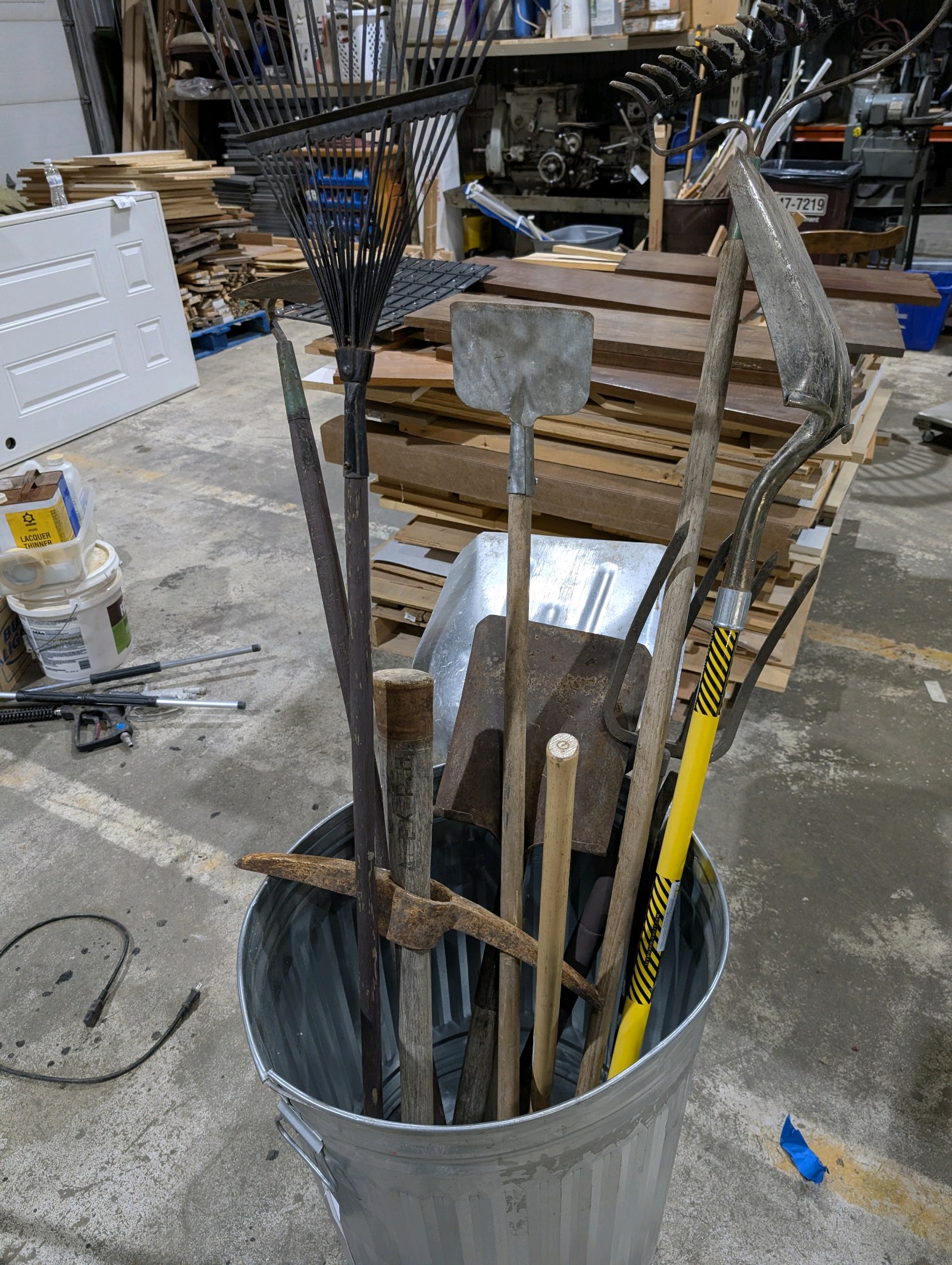 lot 50 image: Large Lot Yard & Garden Tools  Shovels, Rakes, Pitchfork, Pickaxe, Sledgehammer, Hoe, Grain Scoop & Ice Scraper