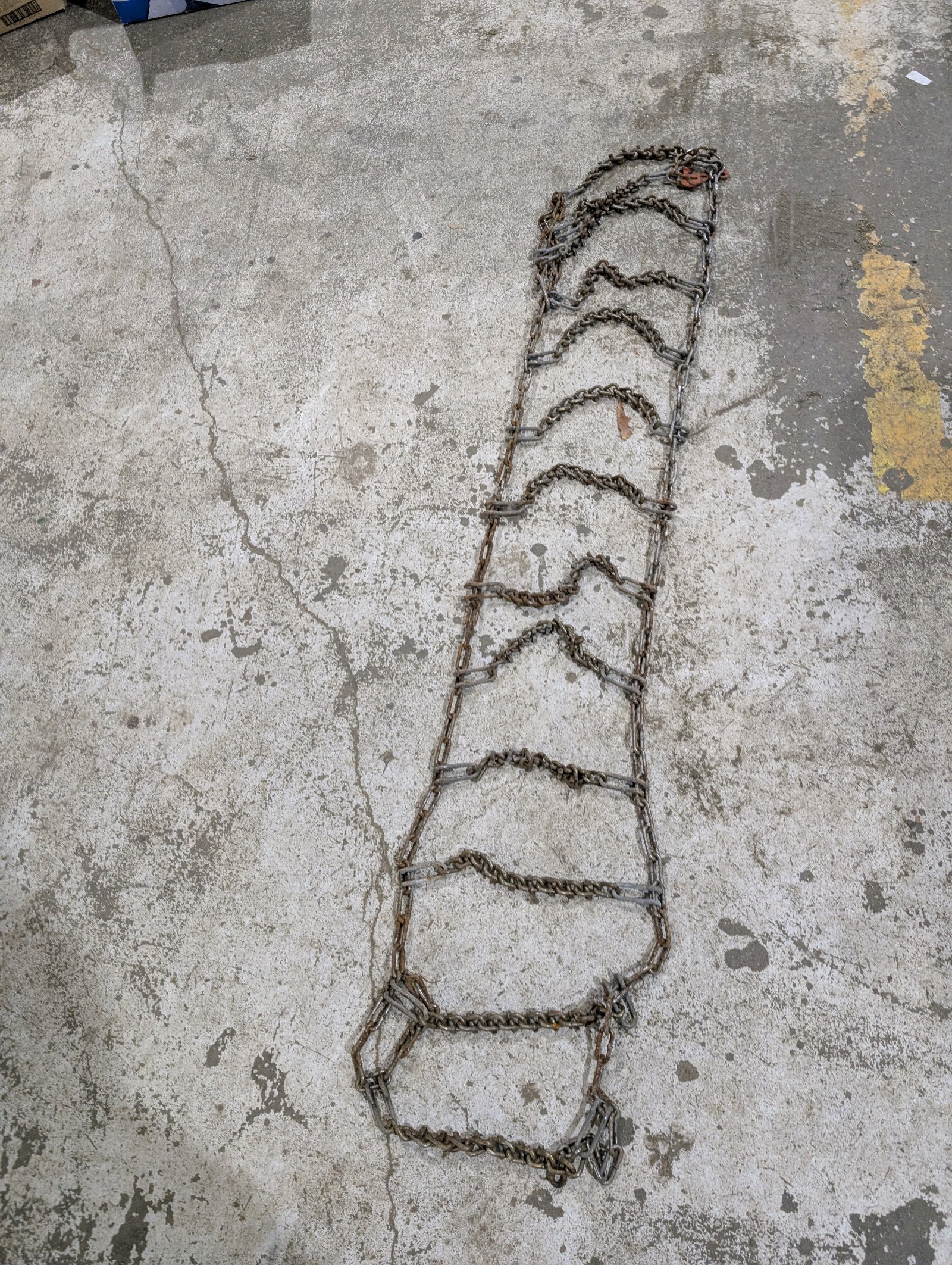 lot 72 image: Heavy Duty Tractor  Skid Steer Tire Chains  Set of 4  Approx. 60 x 12