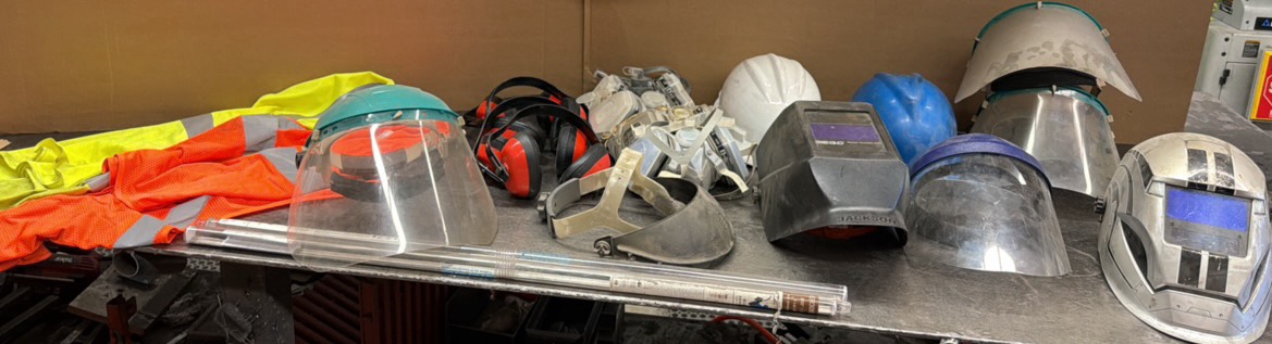 WELDING helmets, construction gear, ear and mouth protection
