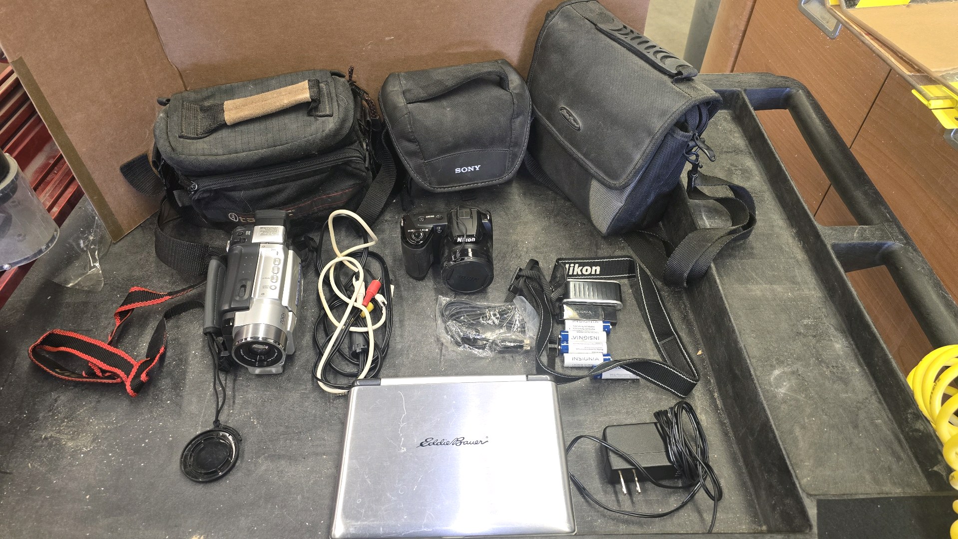 JVC Camcorder, Nikon L105 camera, Eddie Bauer Rechargable  DVD player