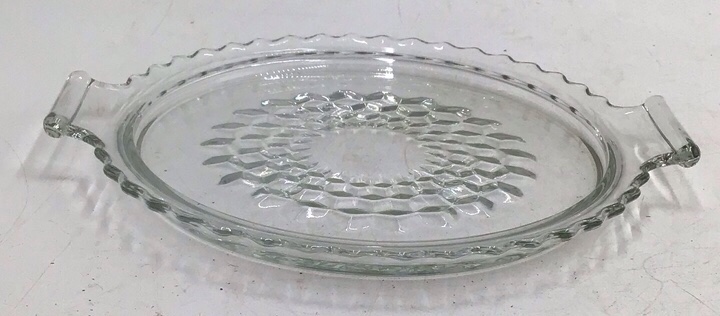 lot 113 image: Vintage Clear Glass Pie Plate  Scalloped Handles and Hobnail Center