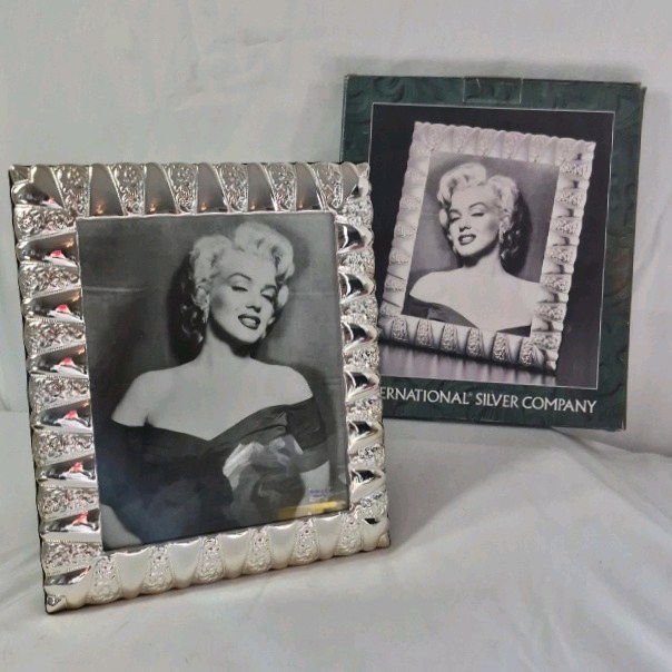 lot 12 image: Framed Marilyn Monroe Photo  Silver Textured Frame by International Silver Company