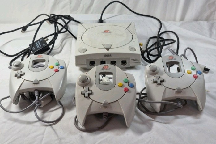 lot 184 image: Sega Dreamcast Console with Three Controllers