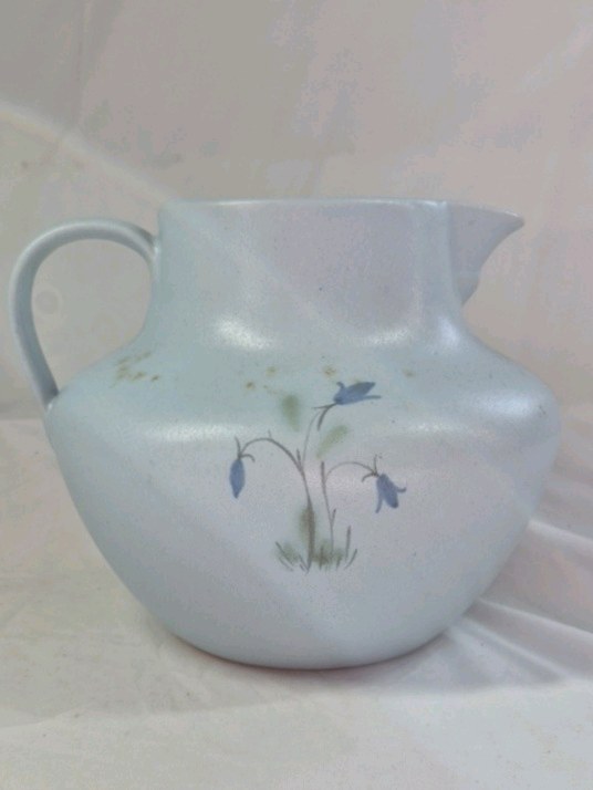 lot 65 image: Vintage Stoneware Pitcher  Light Blue Glaze with Hand-Painted Bluebell Design