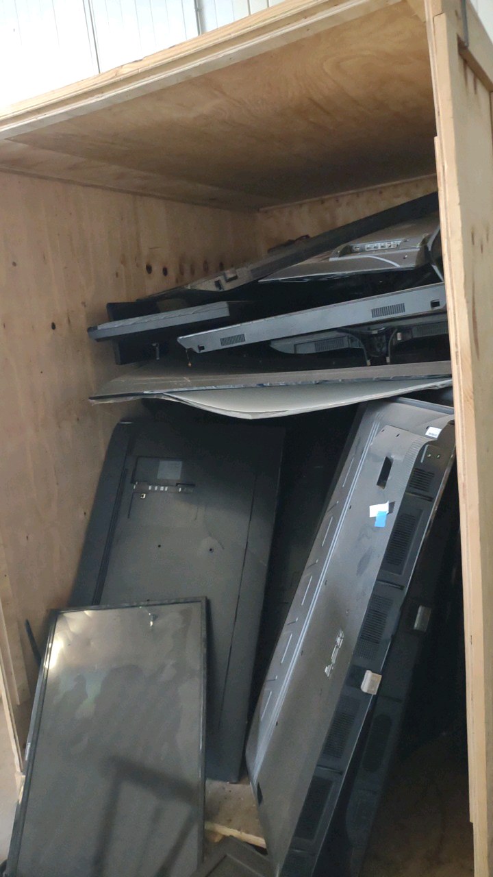 lot 108 image: broken tvs.