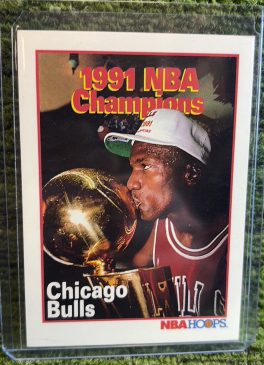 lot 145 image: 1991 NBA Hoops 1991 NBA Champions Chicago Bulls Card - Michael Jordan #543